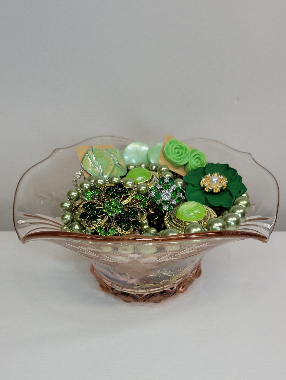 Pink Depression Glass Dish Filled With Jewelry